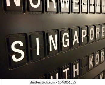 Signs name of Singapore country on black directory board. Used for For currency exchange, airport, business, finance or travel concept, Signs and symbols.