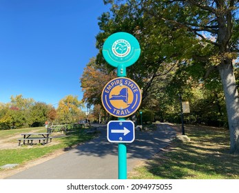 Signs for the NYC Greenway and Empire State Trail on a bicycle path in Riverside Park, Manhattan, New York City