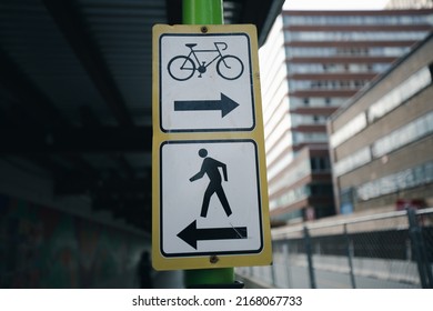 Signs pedestrian arrow and signs bike lane arrow in Boston.