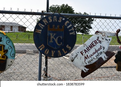 Signs for sale on a wire fence in St. Charles, Missouri. The signs are for the Kansas City Royals and a Farmers Market. Picture taken on September 28th, 2020.