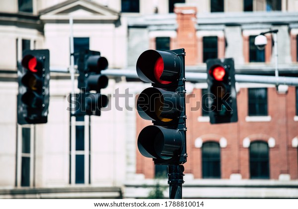 Signs and traffic lights help\
control traffic flow on downtown intersections of\
Boston.