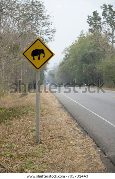 Signs warn\
the elephant cross the road in\
Thailand.