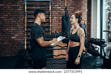 Signup with us, you wont regret it. Shot of a sporty young woman talking to a fitness trainer at the gym.
