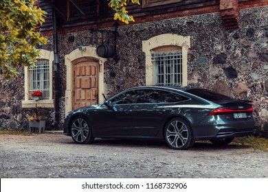 Sigulda, Latvia 30 August Audi A7 Sportback S line stay by old house at background.