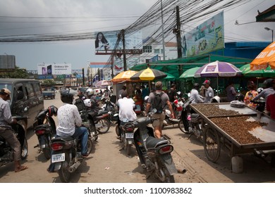 SIHANOUKVILLE, CAMBODIA, MARCH 2018; Chaotic Traffic Outside The Sihanoukville Market. Poor Road Infrastructure Continues To Be A Major Hurdle To Economic Development In Cambodia.