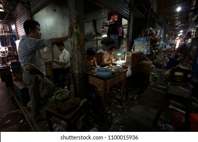 SIHANOUKVILLE, CAMBODIA, MARCH 2018; Jewellers work in sweatshop conditions inside the Sihanoukville Phsar Leu market. Cambodia