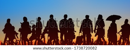 sihouette of group of people sunset sky background