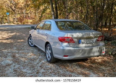 SIKFOKUT, HUNGARY - CIRCA 2019: Toyota Corolla 2011 Model E15 Facelift Parked In A Field Parking Spot By The Forest. Corollas Are One Of The Best Selling Cars In The World