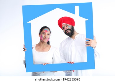 Sikh Family Celebrating Holi With Full Of Happiness