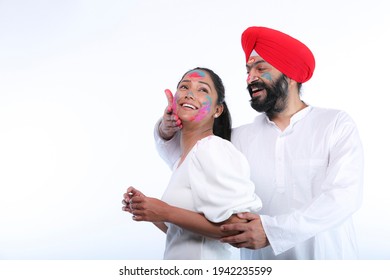 Sikh Family Celebrating Holi With Full Of Happiness