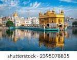 Sikh gurdwara Golden Temple (Harmandir Sahib) and water tank. Holy place of Sikihism. Amritsar, Punjab, India