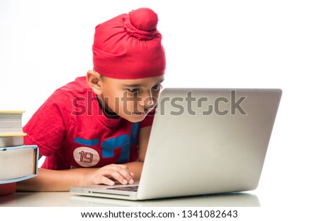 Sikh Indian kid/boy studying using laptop or playing games Stock fotó © 