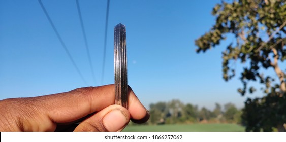 Sikh Khalsa Symbols Iron Bracelet Lohe Da Kara , Circular Kada Iron Bracelet On Nature Background , Photographs Taken In Different Angles.