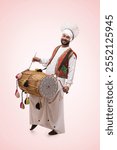 Sikh Man Playing On A Dhol