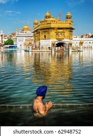 Sikh Prayer In Pond Of Golden Temple, Amritsar, India