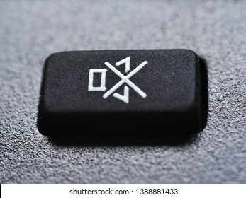 Silence, please. Extreme closeup of the Mute button of a remote control device. Prevent sound pollution, conceptual image.  - Shutterstock ID 1388881433