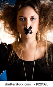 Silenced Eccentric Woman With Tape Over Her Mouth