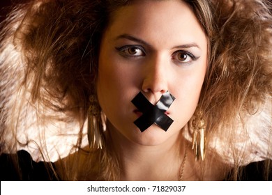 Silenced Eccentric Woman With Tape Over Her Mouth