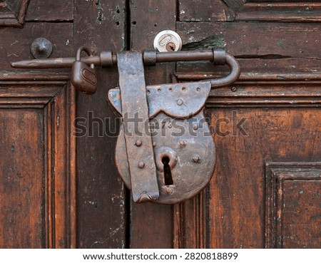 Silent gatekeeper guarding centuries of craftsmanship through iron, wood, and time (Bogota, Colombia: 09-may-2010)