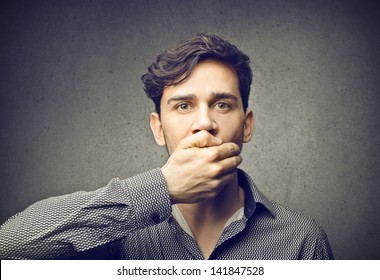 Silent Man With Hand On Mouth