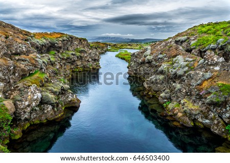 The Silfra fissure between the North American and Eurasian continental plates located in Thingvellir National Park. Beautiful clear water that you can see rocks under the water. 