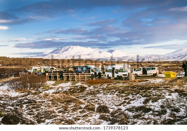 Silfra, Iceland-Feb 22, 2020: Scuba divers  preparing
entering in the water at Silfra rift, the place where Eurasian and
the American tectonic plate are divided in Thingvellir National
Park, Iceland. 