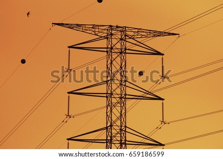 Silhoueet. Electrical tower and backgrounds yellow sky.