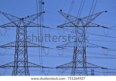Silhoueet. Electrical tower at open sky.