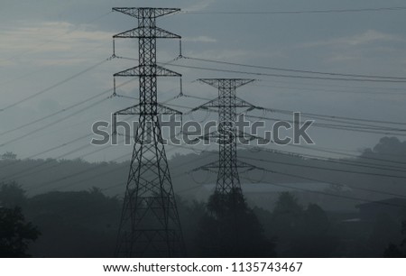 Silhoueet. Row electrical tower at open sky
