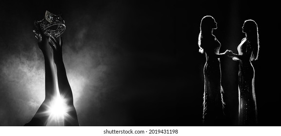 Silhouette abstract of two hands try to reach Diamond Crown as Miss Beauty Queen Pageant Contest as final competition, finale winner moment hold hand together. Backlit smoke copy space - Shutterstock ID 2019431198