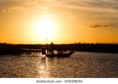 Silhouette Of Airboat In The Sunset At The Swamp