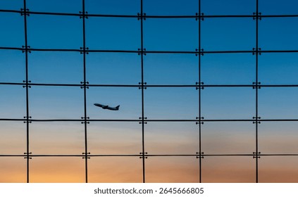 Silhouette of an airplane against a window with square grids and a sunset n the background - Powered by Shutterstock - Get 15% off with code: PIKWIZARD15