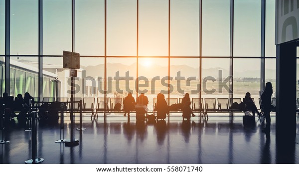 Silhouette of a airport at\
sunset