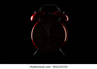 Silhouette Of Alarm Clock On Dark Background
