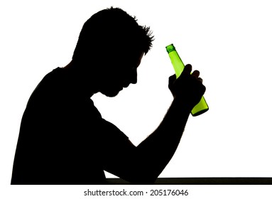 silhouette of alcoholic drunk young man drinking beer bottle feeling depressed falling into addiction problem isolated on white background