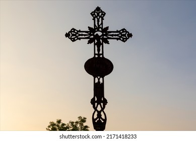 Silhouette Of Ancient Iron Crucifix At The Last Lights Of The Day, Sunset.