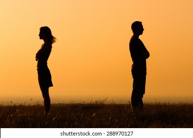 Silhouette of a angry woman and man on each other.Relationship difficulties