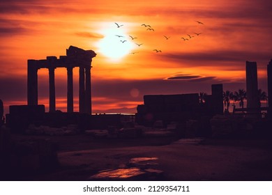 Silhouette of Apollon Temple in Side antique city, temple of Apollon ancient ruins at sunset. Greek ancient historical antique Side Antalya Turkey. - Powered by Shutterstock