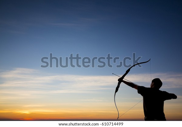 archer shooting arrow towards the stars