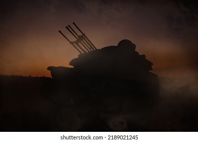 Silhouette Of Armored Fighting Vehicle On Battlefield In Night