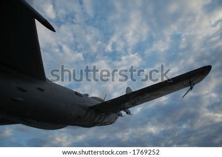 Silhouette army aircraft for storm sky