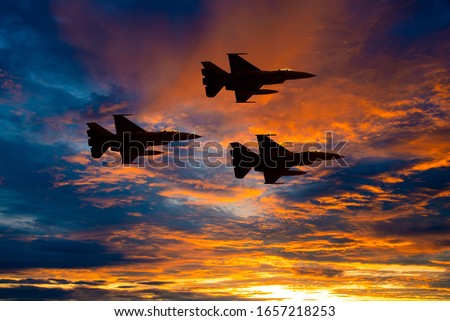 Silhouette army Show performant of air craft in air show with twilight sky background.