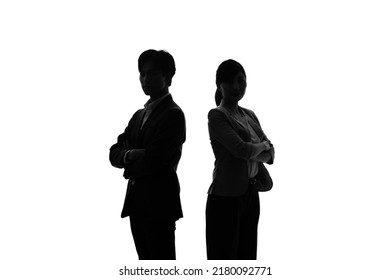 Silhouette of Asian businessman and businesswoman. - Shutterstock ID 2180092771
