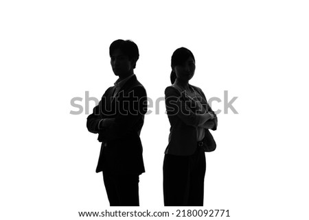 Silhouette of Asian businessman and businesswoman.