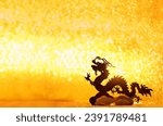 Silhouette of asian dragon on abstract golden glittering background. lunar new year horoscope symbol. Chinese dragon - symbol of deity, wisdom, good start, power. element for design. copy space