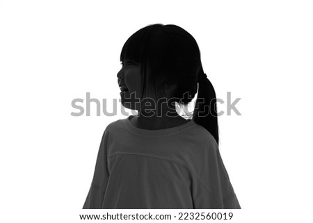 Silhouette of Asian little girl profile.