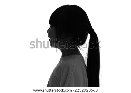 Silhouette of Asian little girl profile.