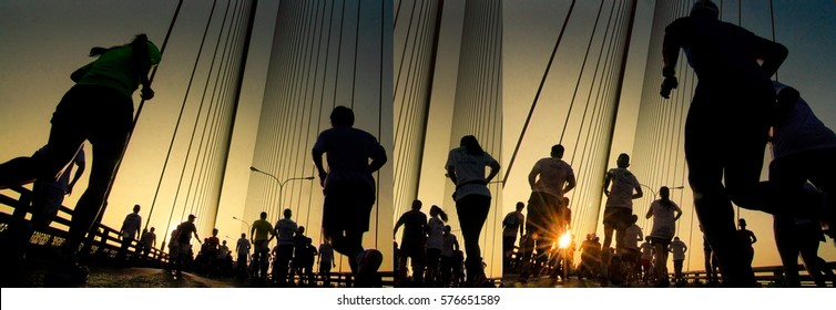 Silhouette Of Athletes Running Marathon With Strong Back Light At Summer Sunrise 
