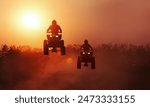 Silhouette ATV or quad bikes jump in track of cross country  racing championship.