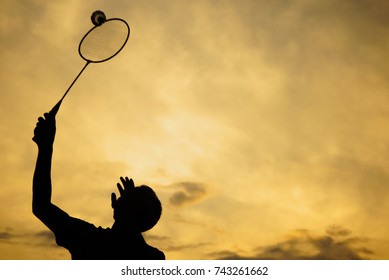 Silhouette Of Badminton Player Against Sunset , Golden Hour